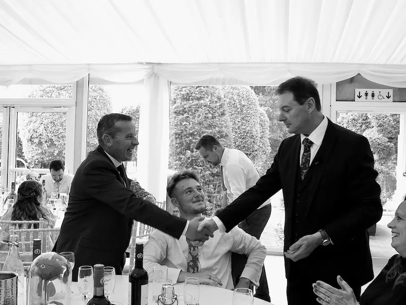 Corporate magician Dave Royal performing for a large audience