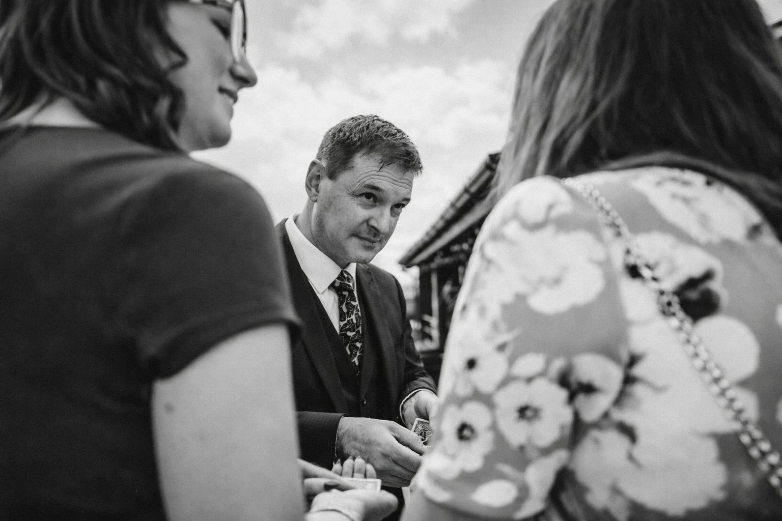 Close-up magician performing for guests